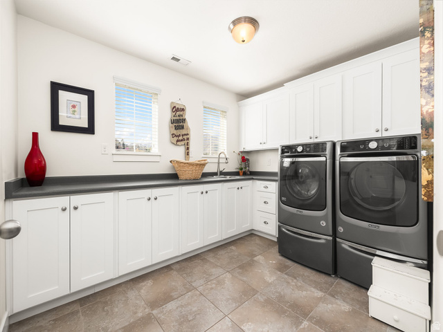 117 Ridge View Drive Elk Ridge, UT 84651 - Photo 28 of 42 Laundry area with cabinet space and washing machine and dryer
