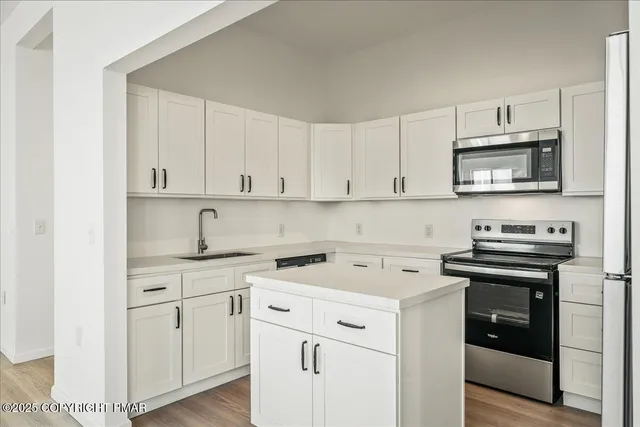 a bathroom with a sink toilet vanity and shower