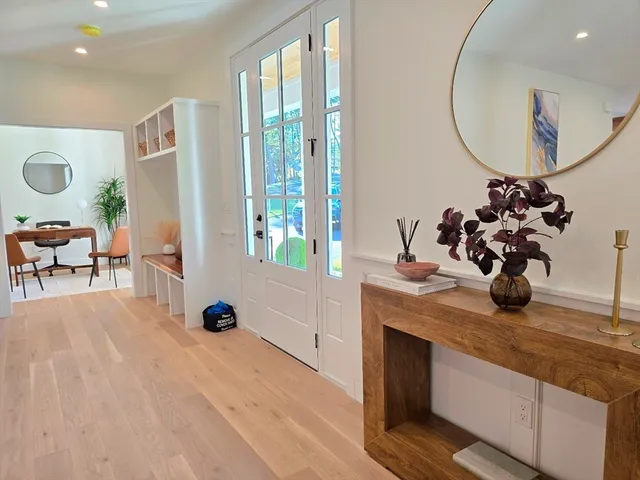 a view of a livingroom with furniture and a chandelier