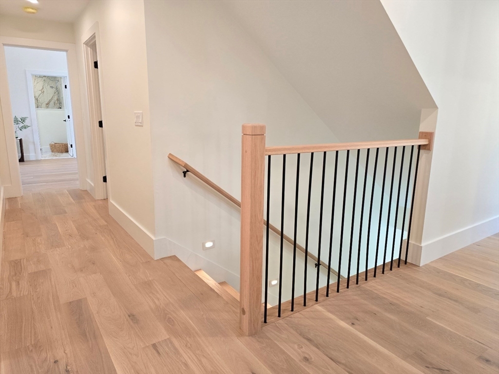 1 Danforth Drive Holliston, MA 01746 - Photo 20 of 42 a view of a hallway with wooden floor and entryway