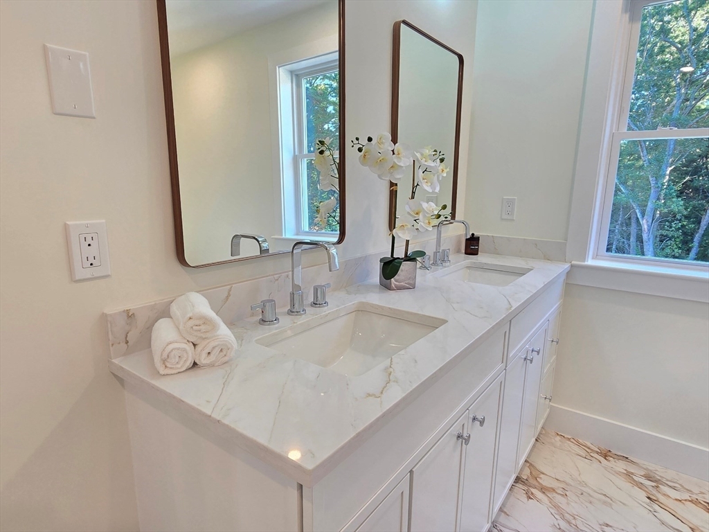1 Danforth Drive Holliston, MA 01746 - Photo 27 of 42 a bathroom with a sink and a mirror