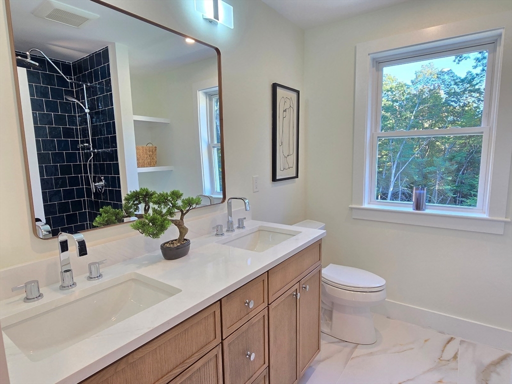 1 Danforth Drive Holliston, MA 01746 - Photo 30 of 42 a bathroom with a sink toilet and shower