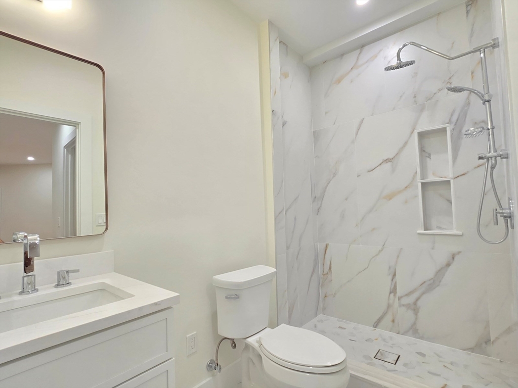 1 Danforth Drive Holliston, MA 01746 - Photo 39 of 42 a bathroom with a sink a toilet and shower