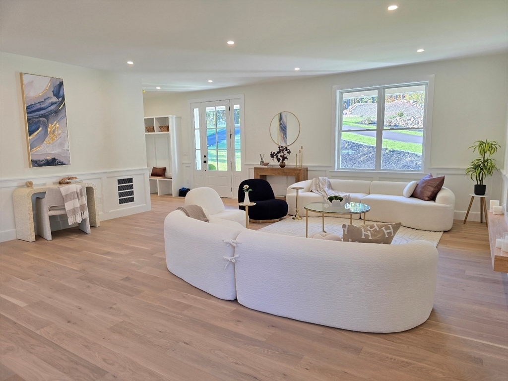 1 Danforth Drive Holliston, MA 01746 - Photo 4 of 42 a living room with furniture and a fireplace
