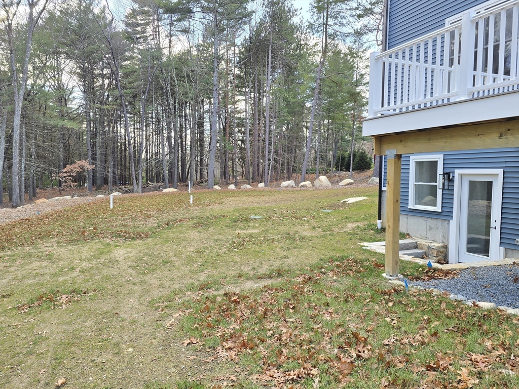 1 Danforth Drive Holliston, MA 01746 - Photo 41 of 42 a backyard of a house with table and chairs