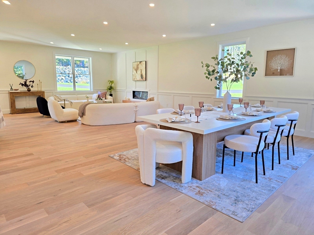 1 Danforth Drive Holliston, MA 01746 - Photo 8 of 42 a living room with furniture a large window and a table