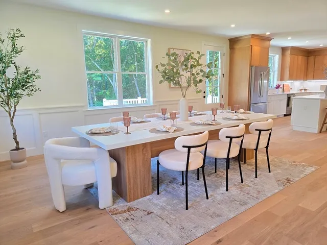a view of a dining room with furniture window and outside view