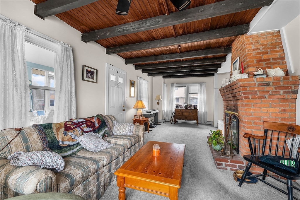 22 12th Road Marshfield, MA 02050 - Photo 11 of 42 a living room with furniture and a fireplace
