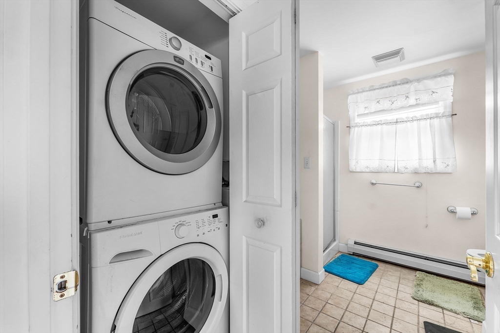 22 12th Road Marshfield, MA 02050 - Photo 14 of 42 a view of a hallway with washer and dryer