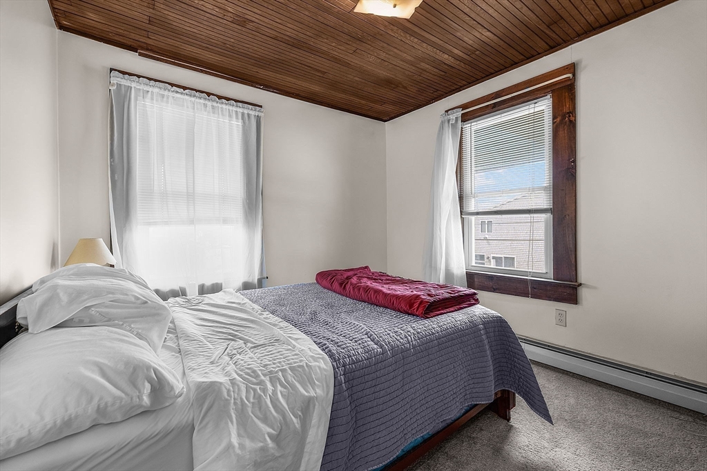 22 12th Road Marshfield, MA 02050 - Photo 15 of 42 a bedroom with a bed and a window