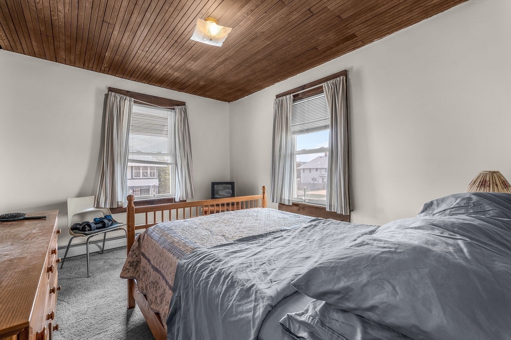 22 12th Road Marshfield, MA 02050 - Photo 16 of 42 a bedroom with a bed and a window