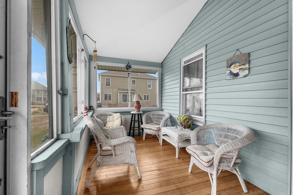 22 12th Road Marshfield, MA 02050 - Photo 20 of 42 a balcony with furniture and wooden floor
