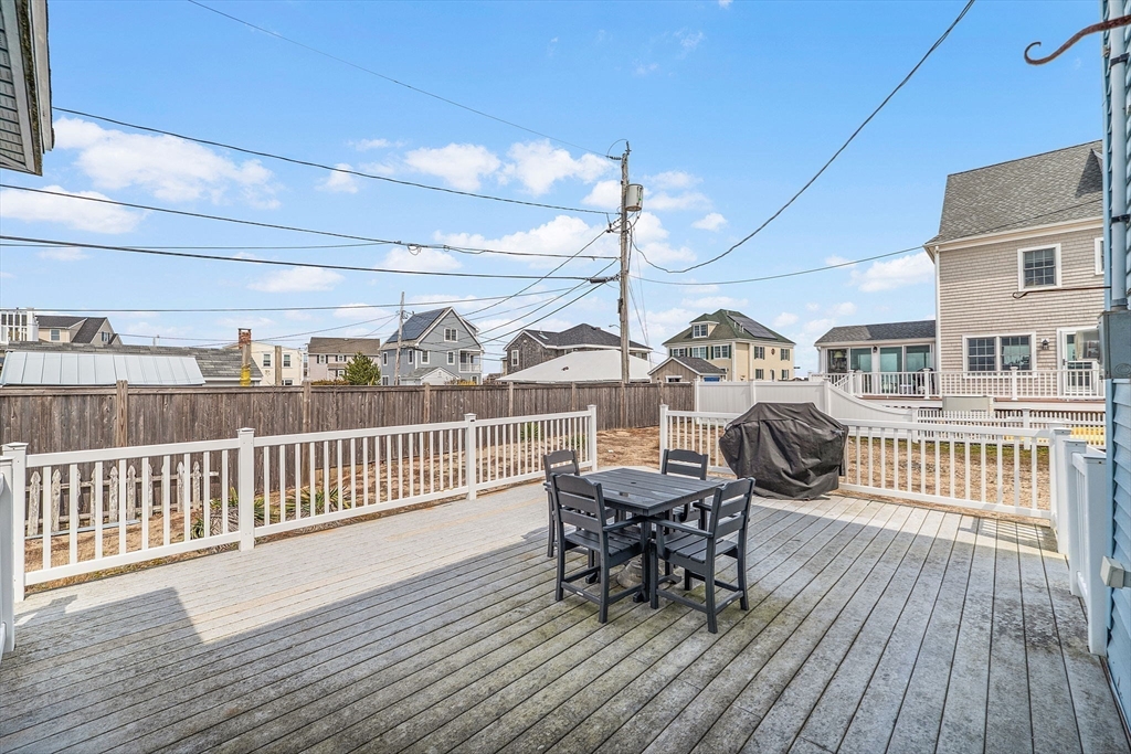 22 12th Road Marshfield, MA 02050 - Photo 22 of 42 a view of a roof deck with table and chairs with wooden floor