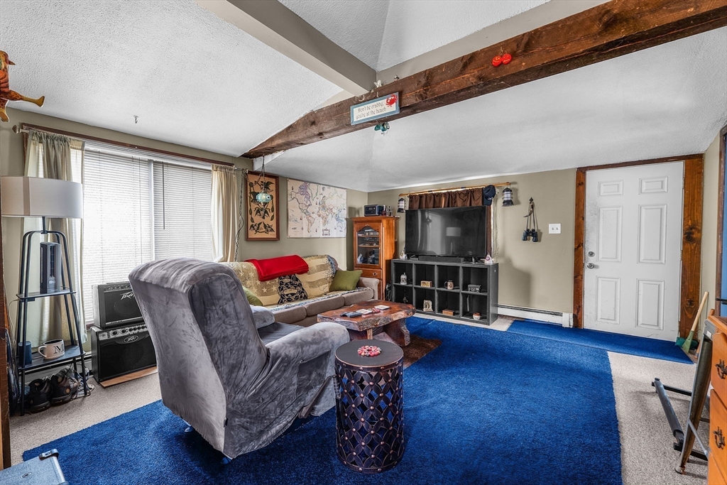22 12th Road Marshfield, MA 02050 - Photo 26 of 42 a living room with furniture and a wooden floor
