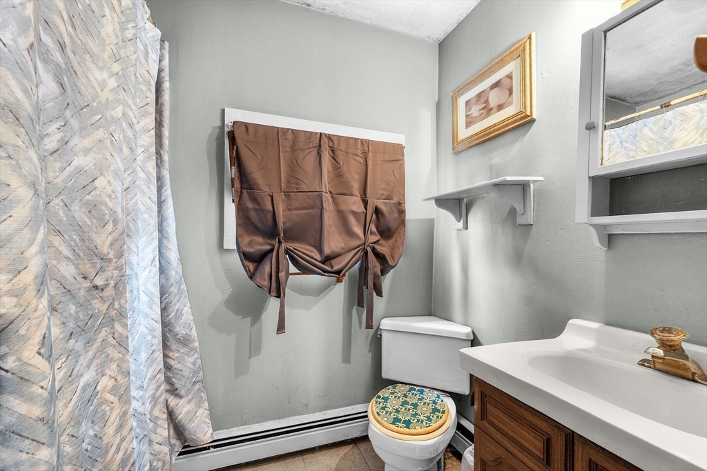 22 12th Road Marshfield, MA 02050 - Photo 28 of 42 a bathroom with a sink and toilet