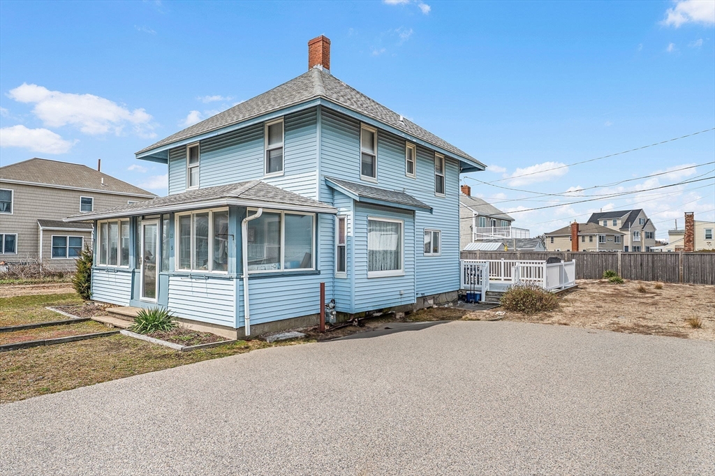 22 12th Road Marshfield, MA 02050 - Photo 5 of 42 a front view of a house with a yard