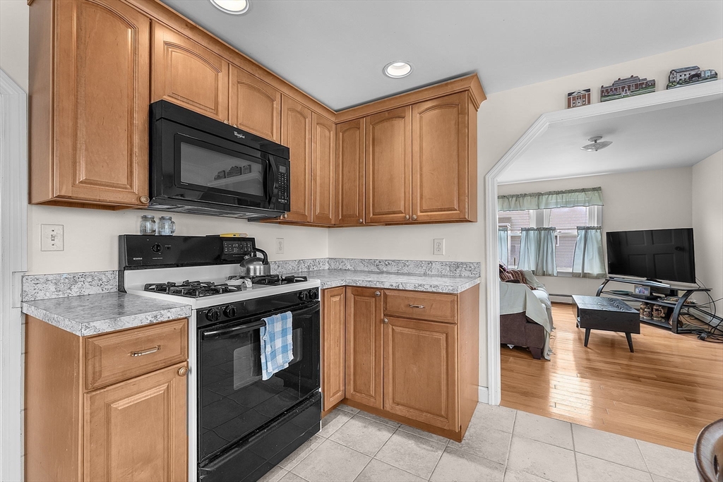 22 12th Road Marshfield, MA 02050 - Photo 6 of 42 a kitchen with a stove top oven sink and cabinets