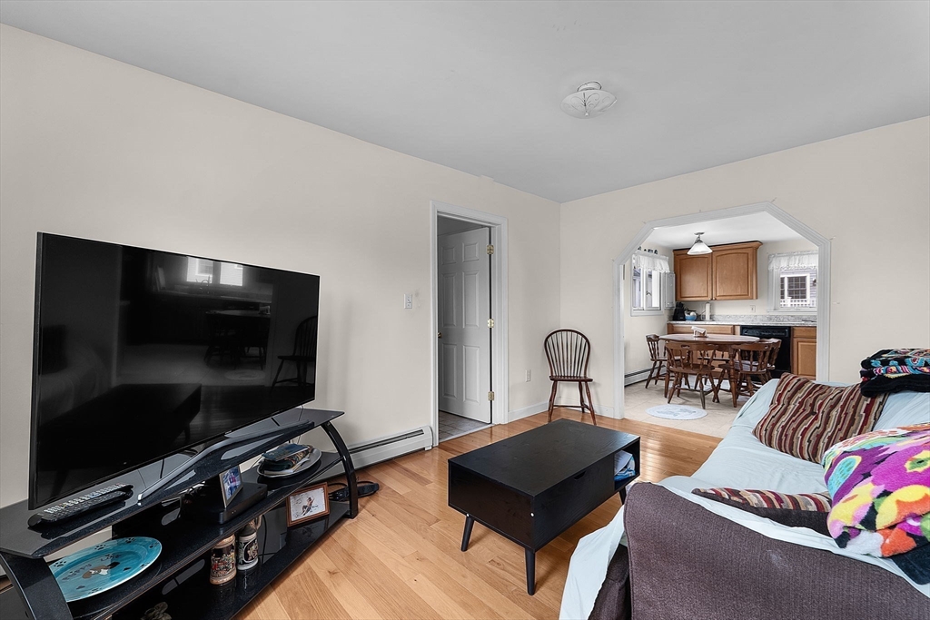 22 12th Road Marshfield, MA 02050 - Photo 9 of 42 a living room with furniture and a flat screen tv