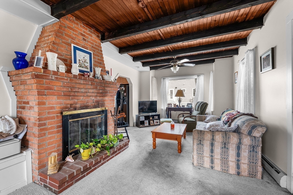 22 12th Road Marshfield, MA 02050 - Photo 10 of 42 a living room with furniture and a fireplace