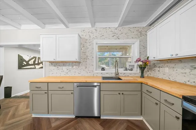 a kitchen with a sink and cabinets