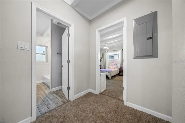 a bedroom with a bed dresser and a window