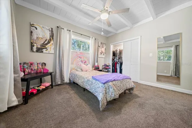 a bathroom with a granite countertop shower a sink and a shower