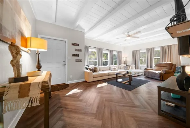 a living room with furniture and a lamp