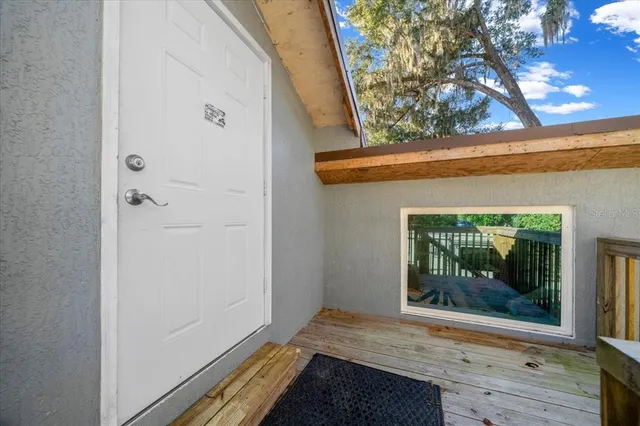 a view of kitchen with furniture and wooden floor