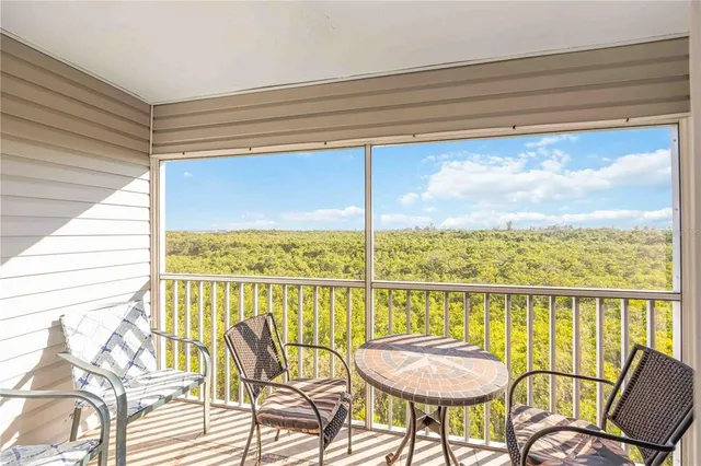 a view of a chairs and table in a balcony