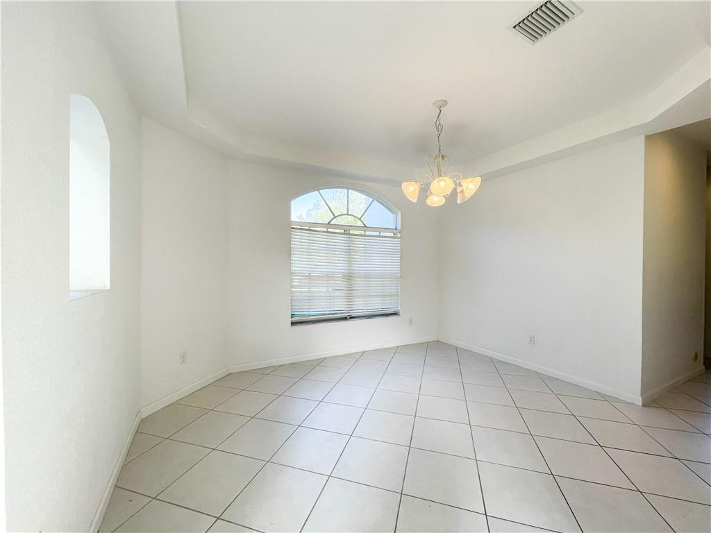 6150 Hancock Road Southwest Ranches, FL 33330 - Photo 20 of 41 an empty room with windows and chandelier