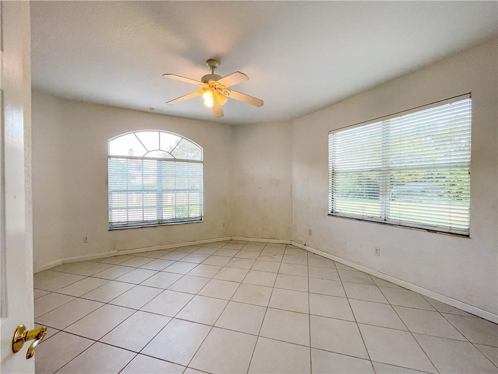 6150 Hancock Road Southwest Ranches, FL 33330 - Photo 21 of 41 an empty room with windows and chandelier fan