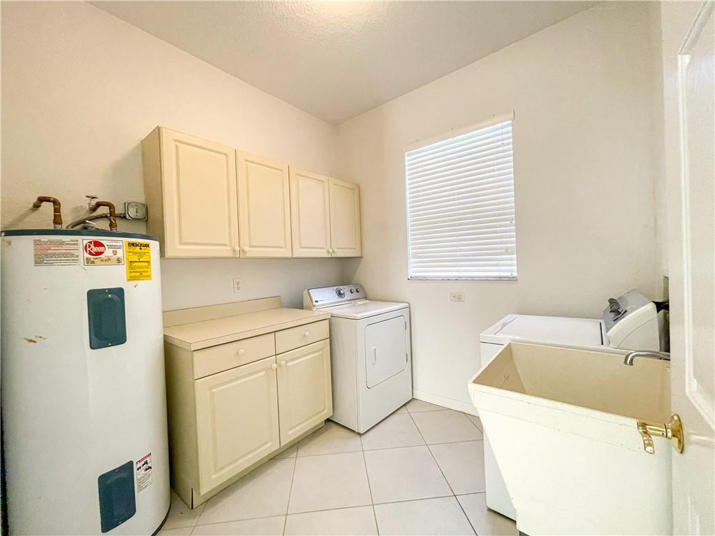 6150 Hancock Road Southwest Ranches, FL 33330 - Photo 24 of 41 a utility room with cabinets washer and dryer