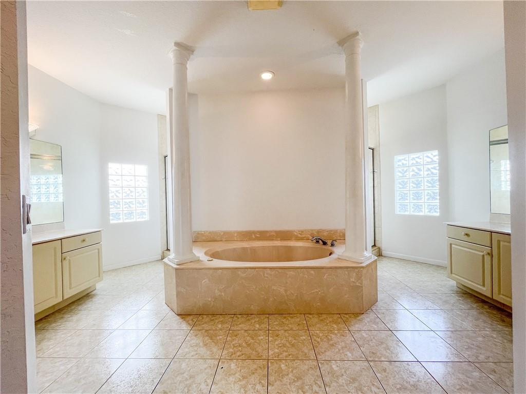 6150 Hancock Road Southwest Ranches, FL 33330 - Photo 29 of 41 a spacious bathroom with a tub shower and mirror