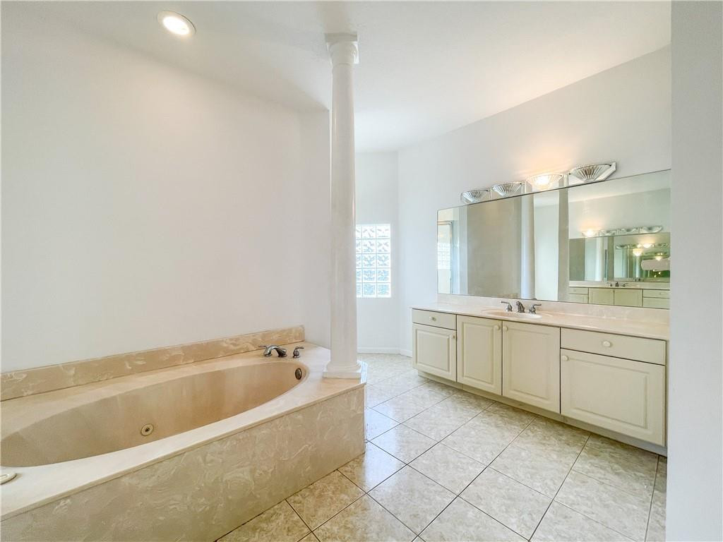 6150 Hancock Road Southwest Ranches, FL 33330 - Photo 31 of 41 a large bathroom with a tub a sink a mirror and a shower