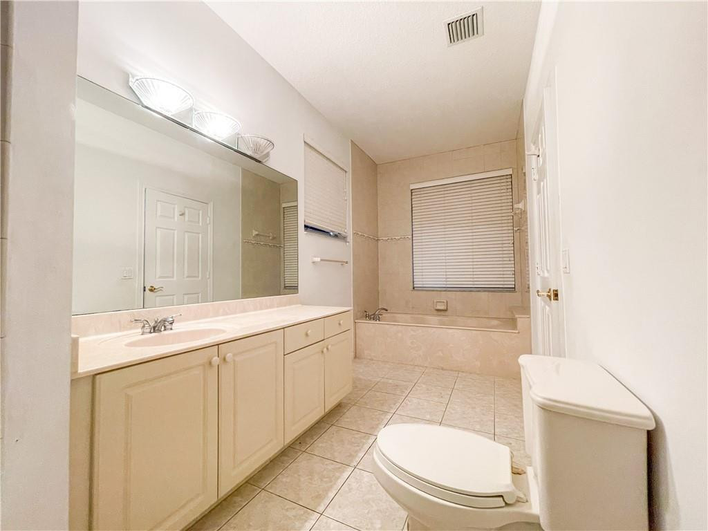 6150 Hancock Road Southwest Ranches, FL 33330 - Photo 32 of 41 a bathroom with a sink a toilet and mirror