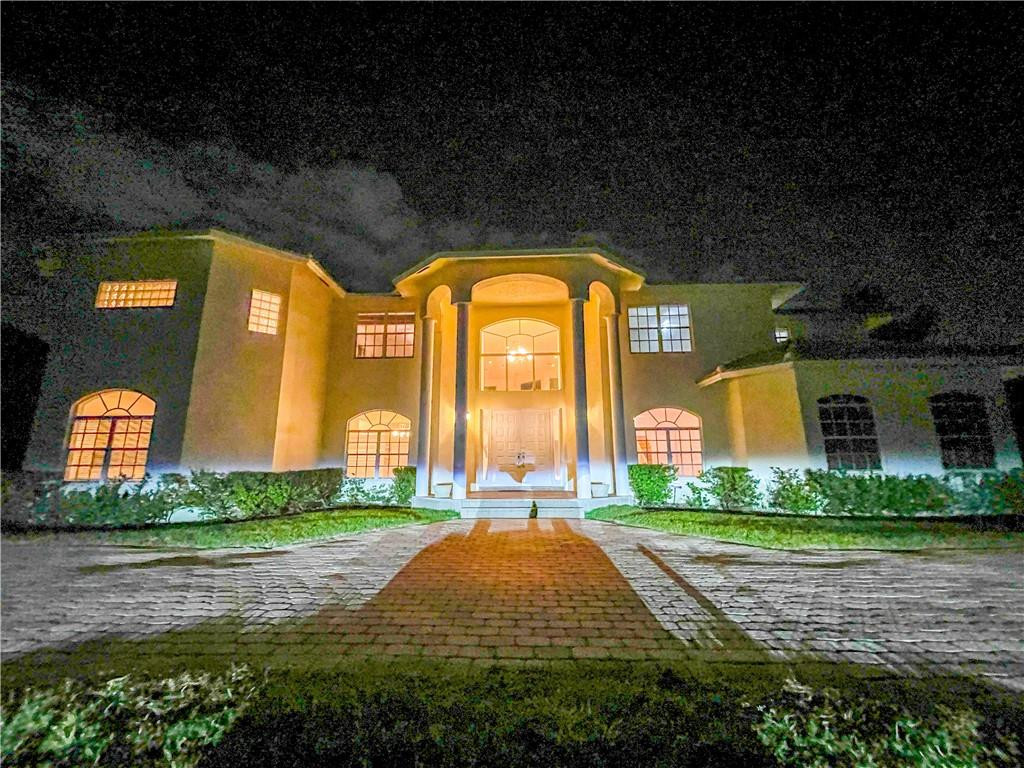 6150 Hancock Road Southwest Ranches, FL 33330 - Photo 5 of 41 a large house with a big yard and potted plants