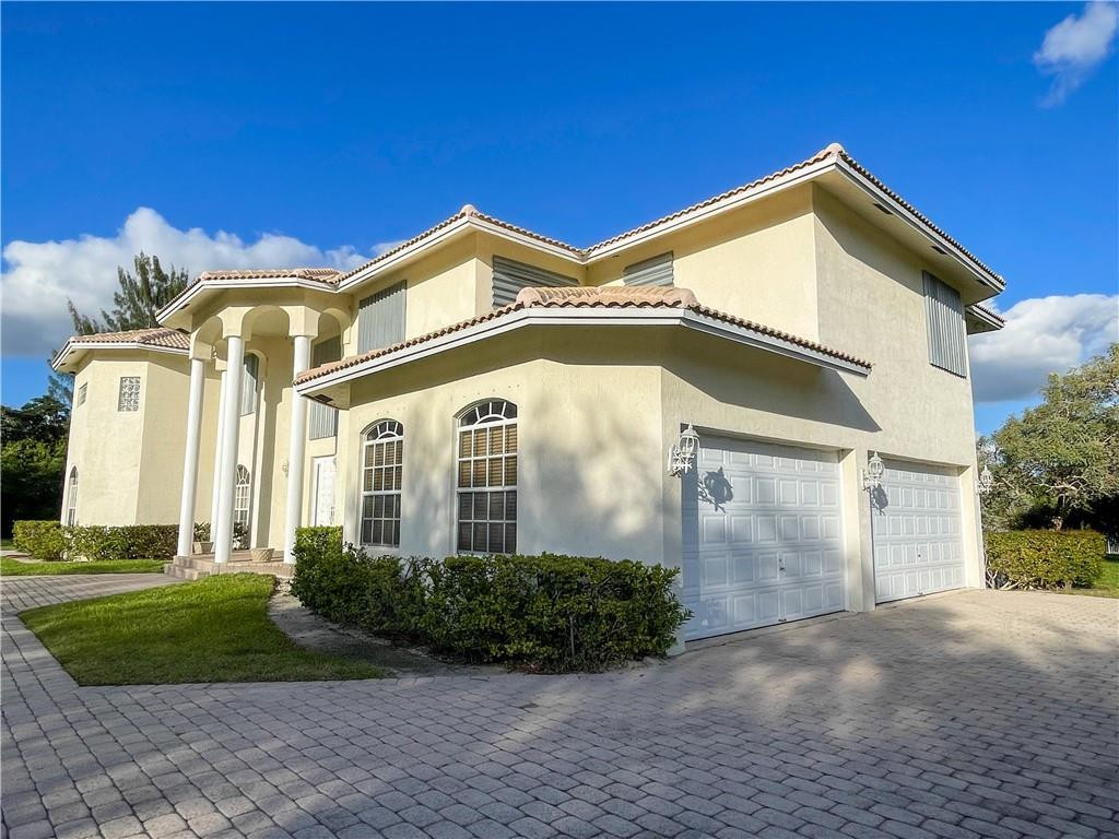 6150 Hancock Road Southwest Ranches, FL 33330 - Photo 9 of 41 a view of a white house next to a yard