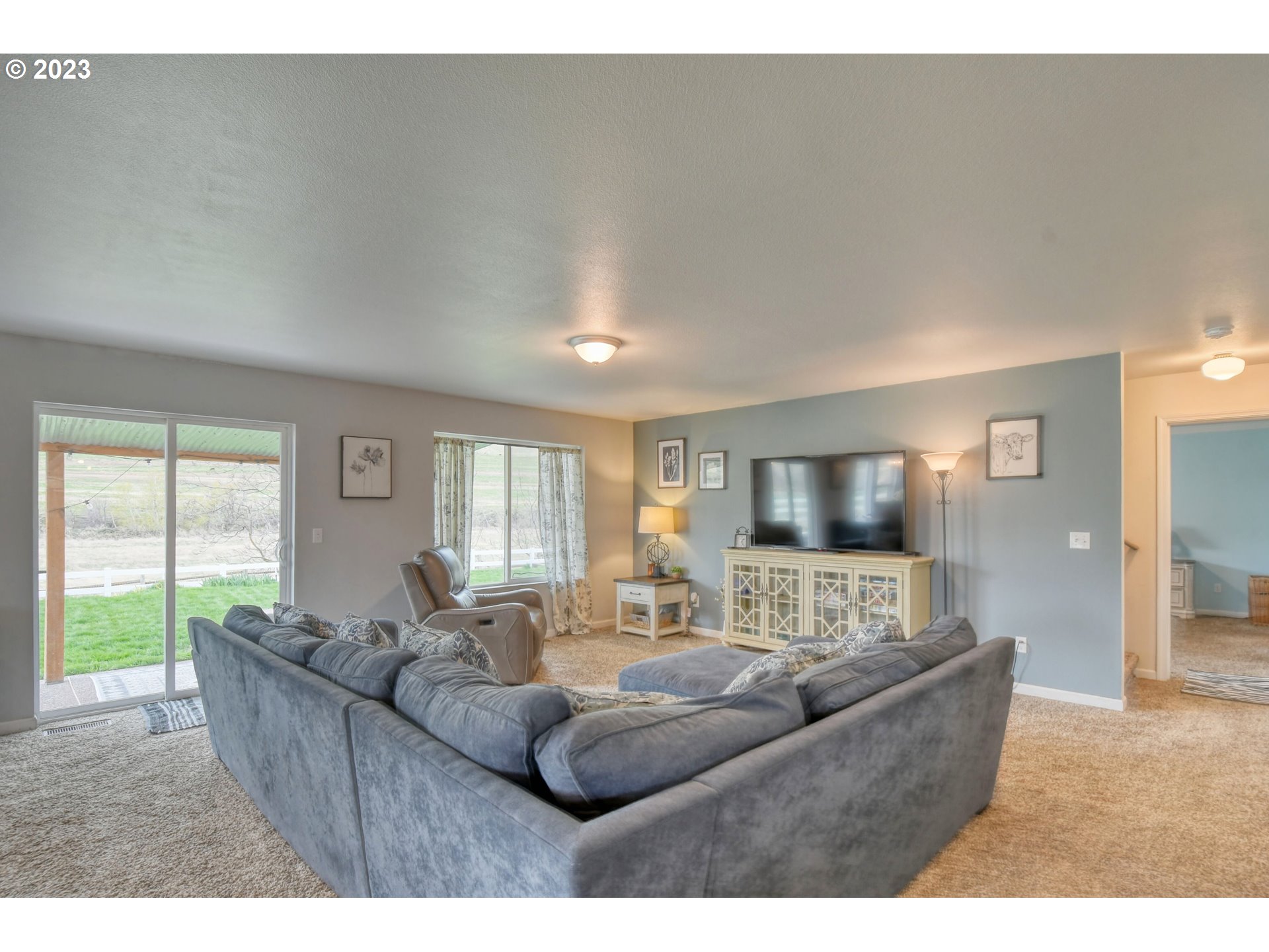39532 Rieth Road Echo, OR 97826 - Photo 11 of 39 a living room with furniture and a flat screen tv