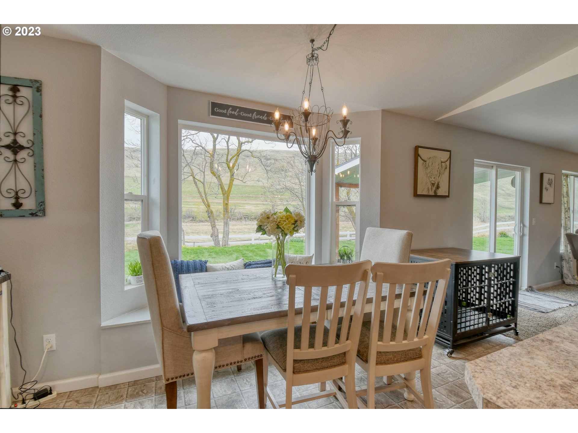 39532 Rieth Road Echo, OR 97826 - Photo 17 of 39 a dining room with furniture a chandelier and wooden floor