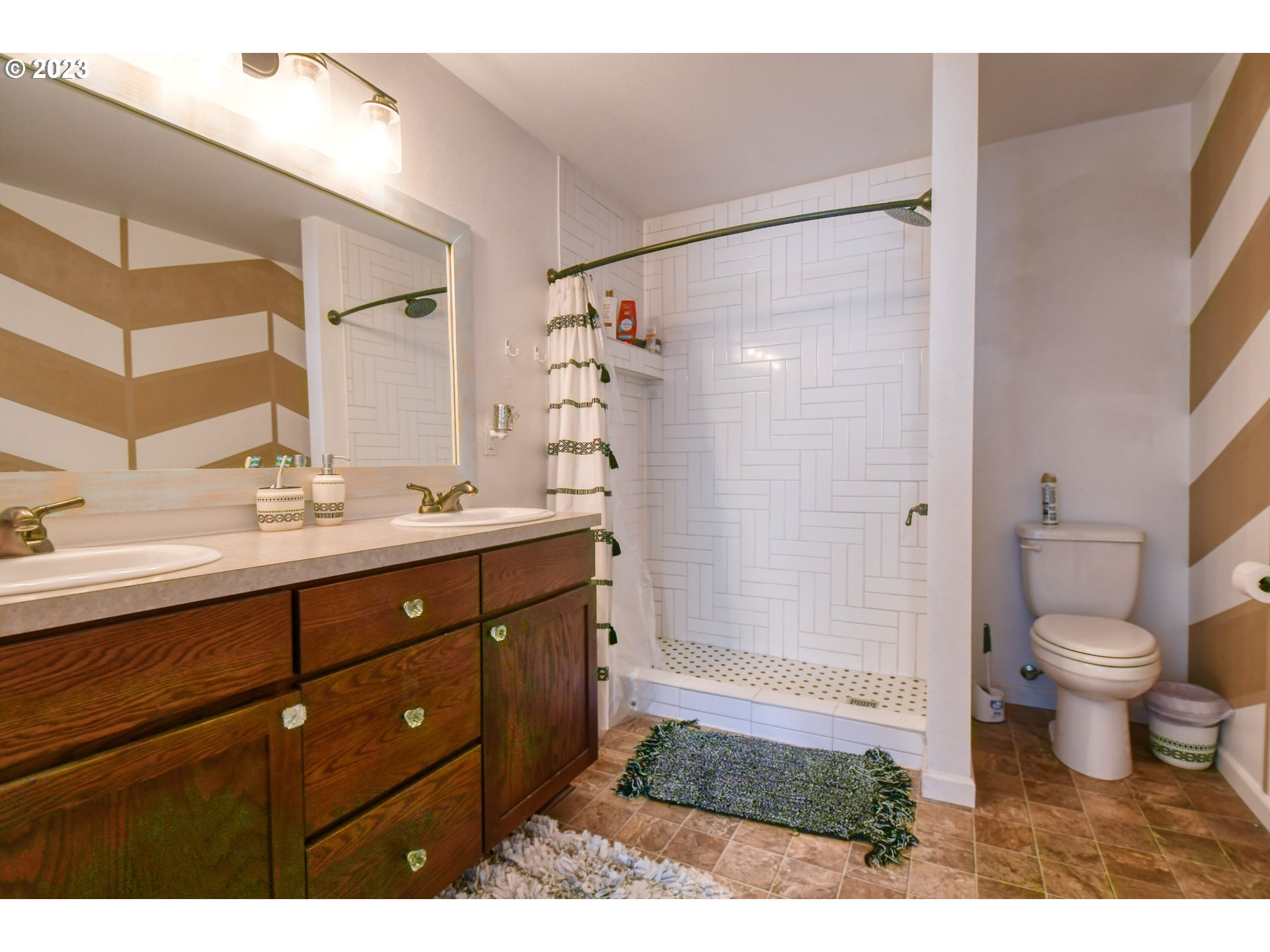 39532 Rieth Road Echo, OR 97826 - Photo 23 of 39 a bathroom with a shower sink vanity mirror and toilet