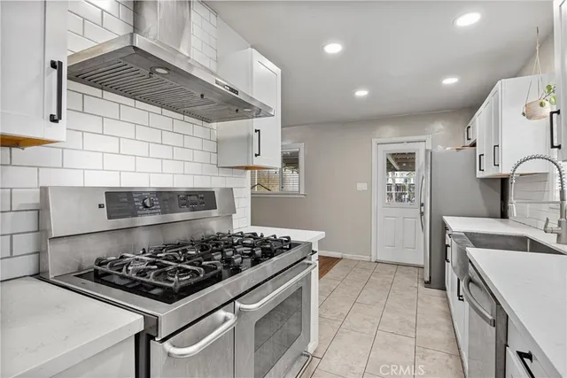 a kitchen with a stove and a sink
