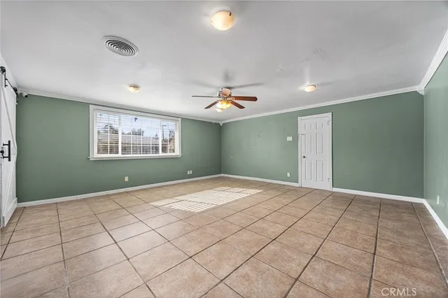 a view of an empty room and window