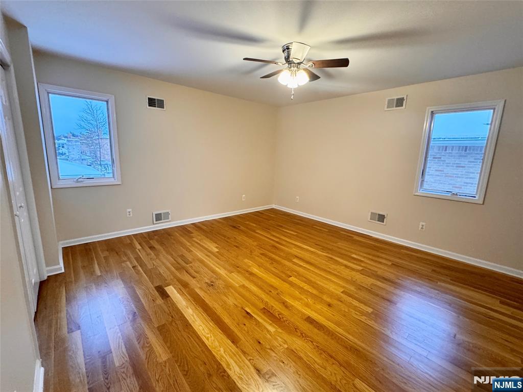 57 Franklin Street, Unit 2 Elmwood Park, NJ 07407 - Photo 17 of 19 a view of a room with wooden floor and white walls