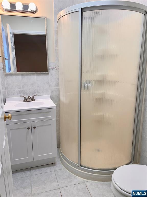 57 Franklin Street, Unit 2 Elmwood Park, NJ 07407 - Photo 19 of 19 a bathroom with a sink toilet and shower