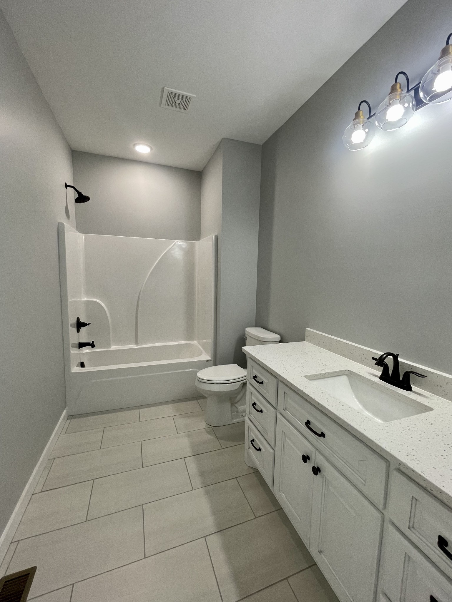 1448 Fall River Road Lawrenceburg, TN 38464 - Photo 11 of 30 a bathroom with a granite countertop sink a toilet a mirror and vanity