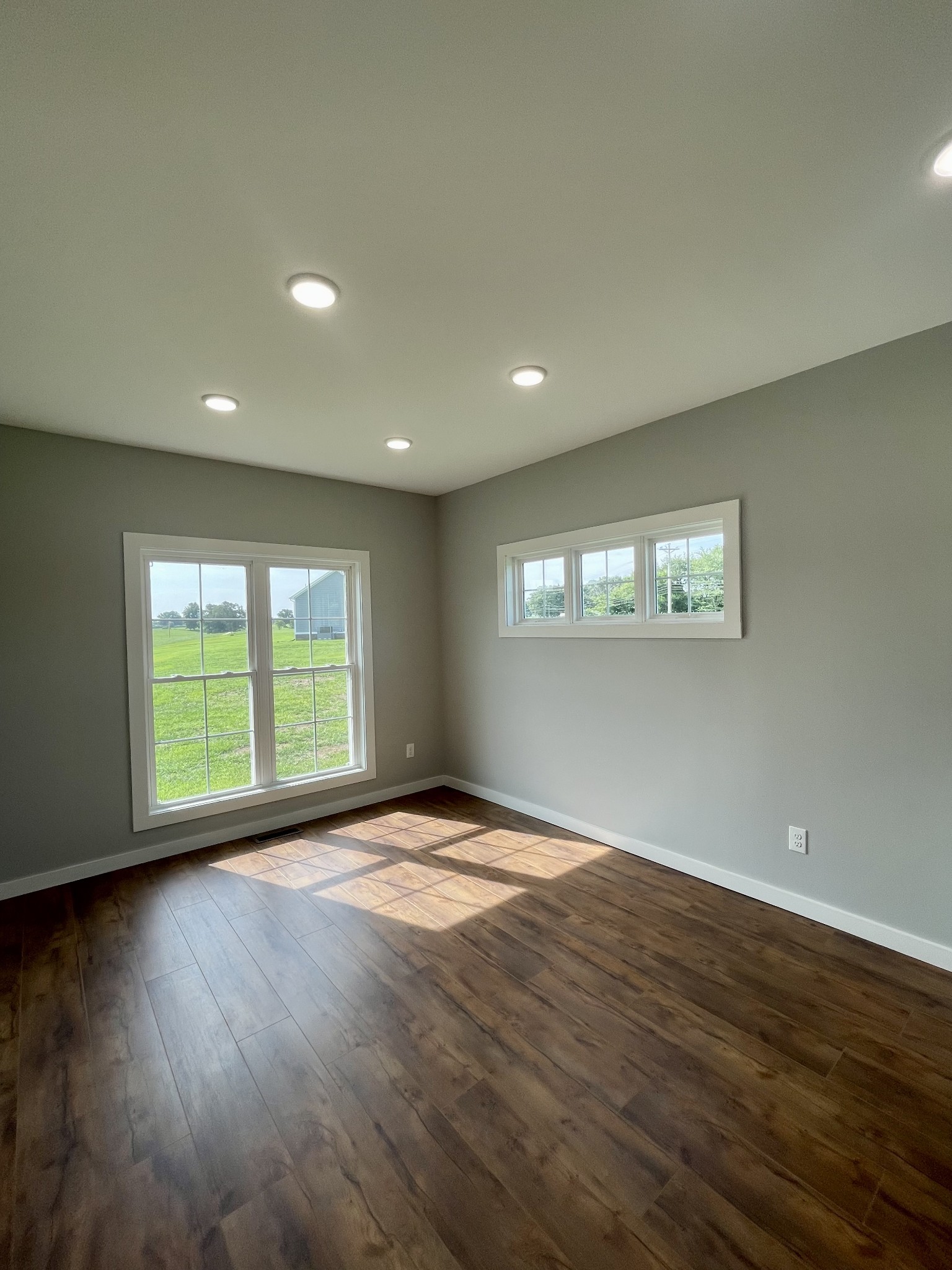 1448 Fall River Road Lawrenceburg, TN 38464 - Photo 13 of 30 a view of an empty room with wooden floor and a window