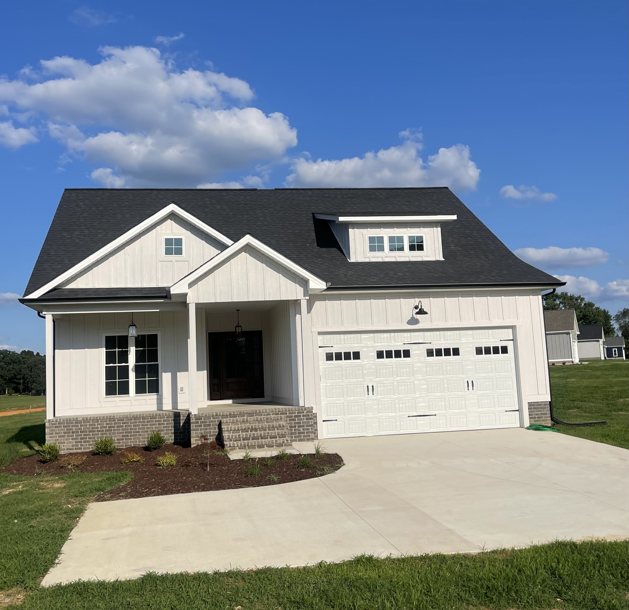 1448 Fall River Road Lawrenceburg, TN 38464 - Photo 29 of 30 a front view of a house with a yard and garage