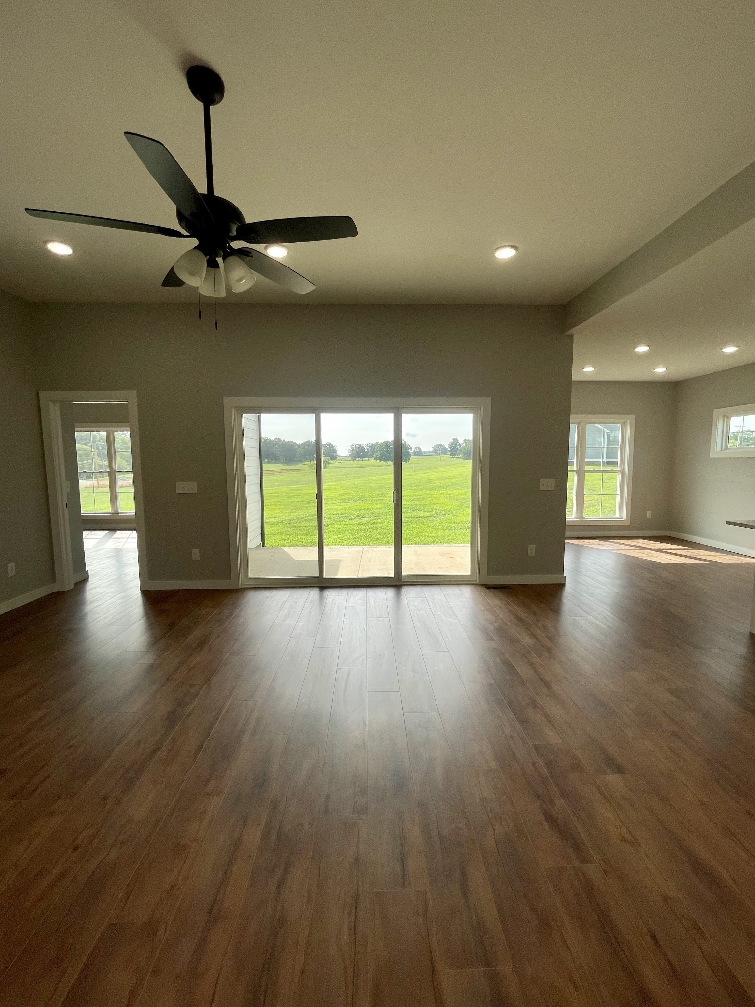 1448 Fall River Road Lawrenceburg, TN 38464 - Photo 3 of 30 a view of empty room with wooden floor and fan
