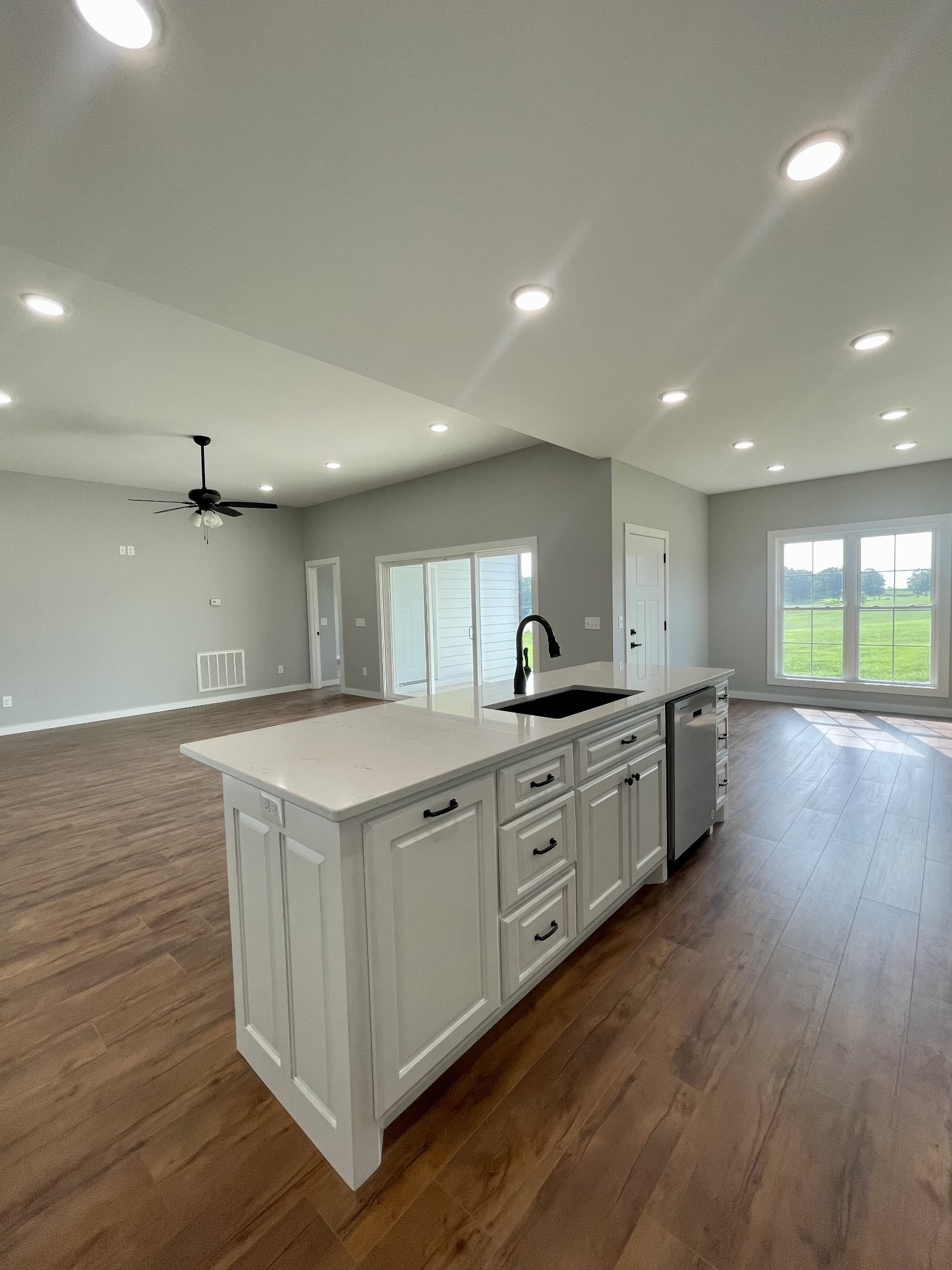 1448 Fall River Road Lawrenceburg, TN 38464 - Photo 6 of 30 a large kitchen with stainless steel appliances granite countertop a large center island and a wooden floors