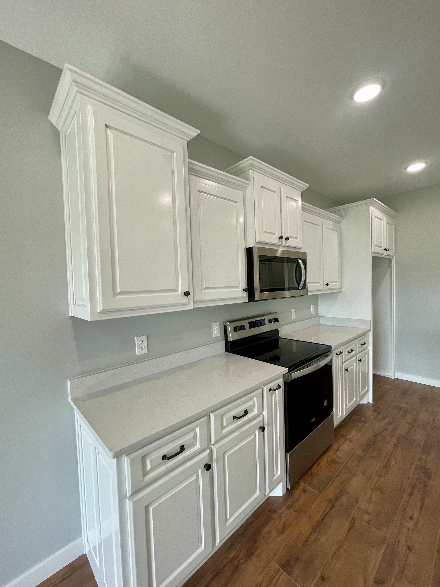 1448 Fall River Road Lawrenceburg, TN 38464 - Photo 7 of 30 a kitchen with stainless steel appliances granite countertop a sink stove and microwave